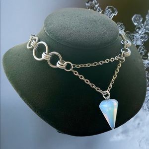 Handmade maille steel choker necklace with iridescent opalite pendulum charm .